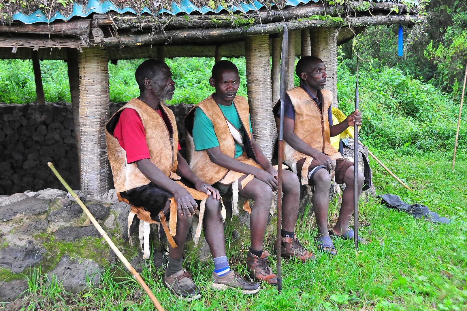 An image of Batwa men at Boma cultural village, part of the Batwa visit and birding safari.